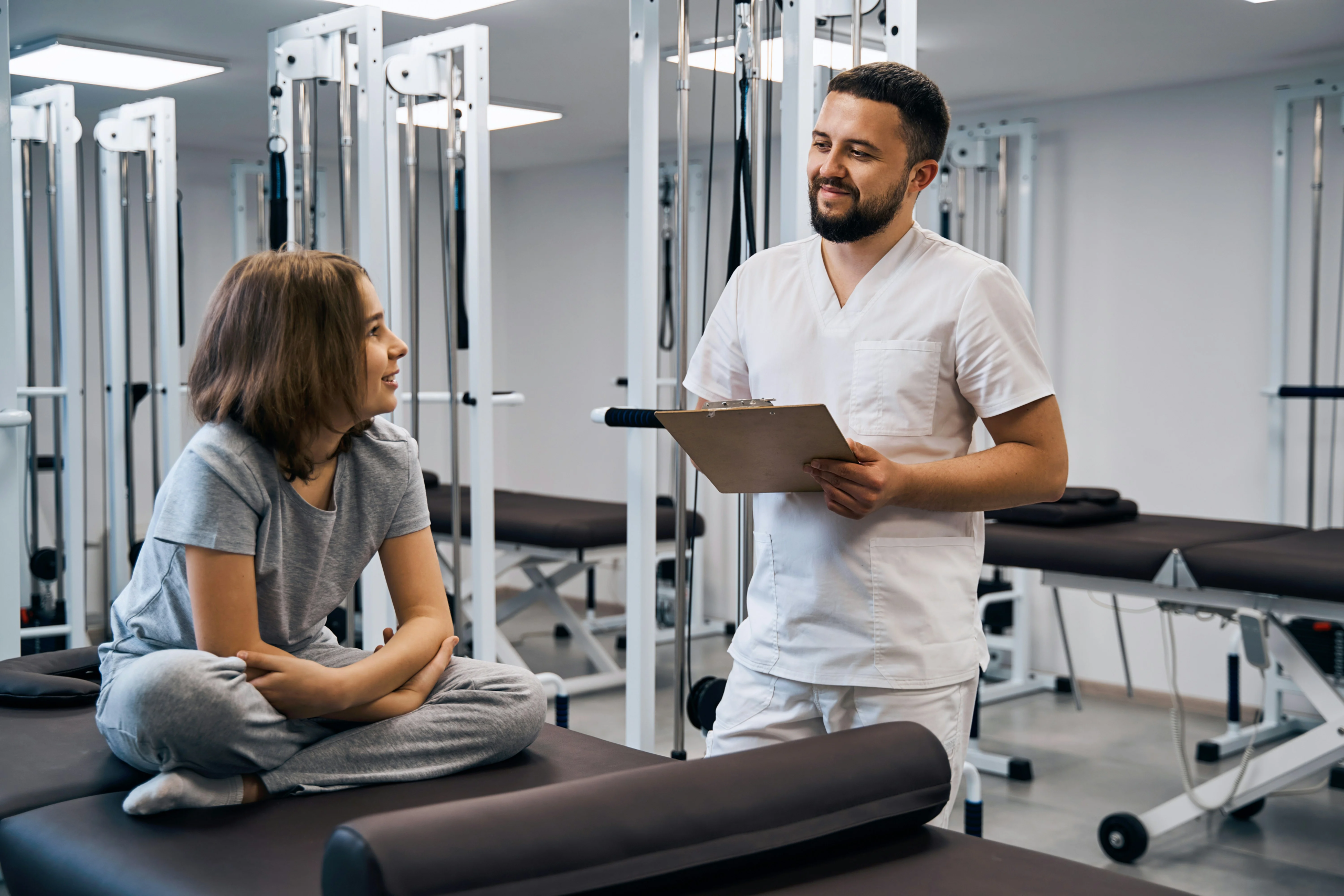man working at a PT clinic