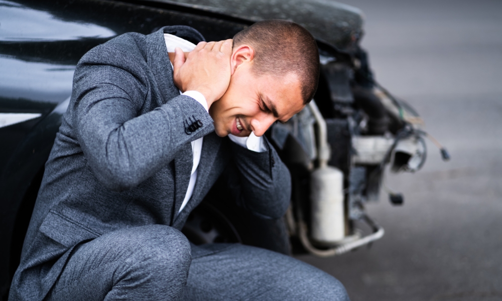 Physical therapist providing whiplash rehabilitation after car accident injury