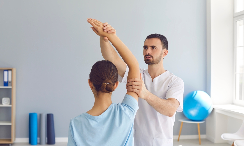 Physical therapist evaluating patient movement during rehabilitation assessment