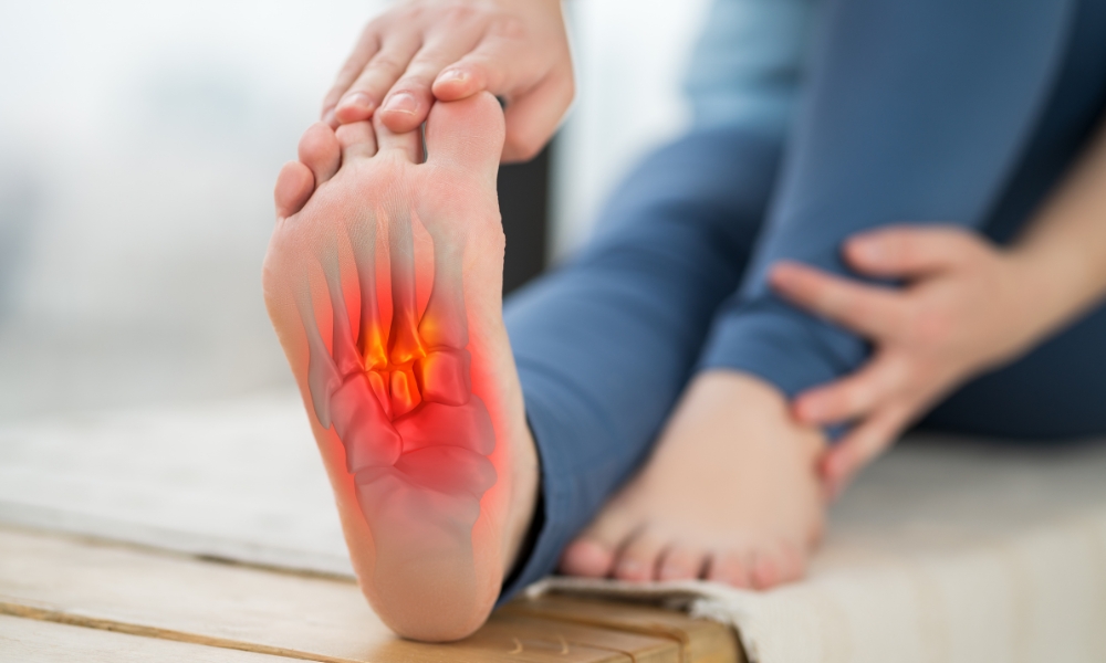 Physical therapist evaluating plantar fasciitis and heel pain during foot assessment