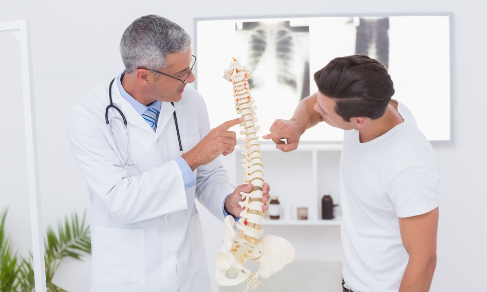 Physical therapist evaluating patient movement during rehabilitation assessment